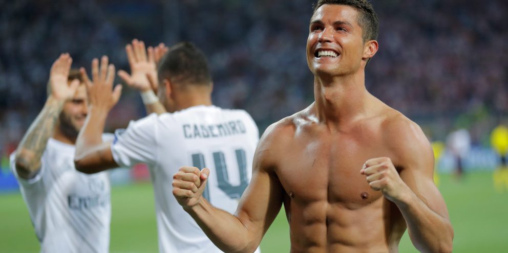 Real Madrid's Cristiano Ronaldo celebrates after scoring the winning penalty shot during the Champions League final soccer match between Real Madrid and Atletico Madrid at the San Siro stadium in Milan, Italy, Saturday, May 28, 2016. Real Madrid won 5-4 on penalties after the match ended 1-1 after extra time.    (AP Photo/Manu Fernandez) ORG XMIT: XAF257
