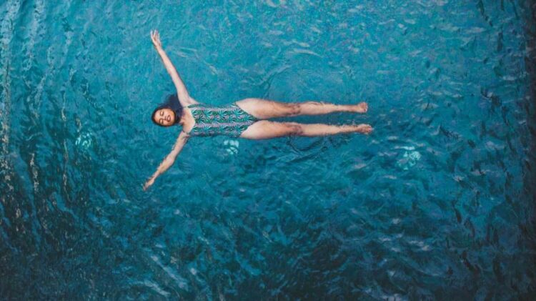 Overhead View Of The Young Woman Floating In The Pool20s, Asia, Asian, Beautiful, Blue, Copy space, Enjoy, Floating, Gorgeous, Holiday, Leisure, Lifestyle, Natural, Outdoor, People, Pool, Recreation, Relaxing, Sensual, Stocksywac, Stunning, Summer, Summertime, Sunbathe, Swimming, Swimming pool, Swimsuit, Swimwear, Tanned, Thailand, Tropic, Turquoise, Vacation, Vertical, Water, Water, Wet, Woman, Young